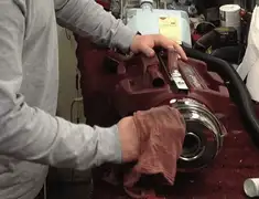 Vacuum repair technician cleaning and servicing a vacuum motor in Yonkers, NY